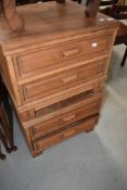 A pair of Oriental hardwood bedside drawer units