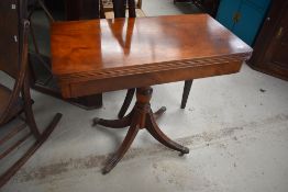 A nice quality reproduction Regency style fold over card table, width approx. 85cm