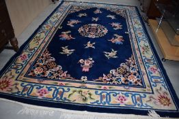 A Chinese carpet square , having deep blue ground, foliate and vase pattern, approx 310 x 197cm