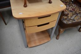 A modern office or similar occasional table with double drawer