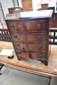 A reproduction Regency bedside chest of four drawers