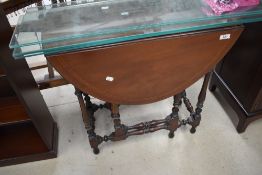 A nice quality reproduction mahogany gateleg table having turned frame and inlay decoration