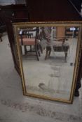 A modern gilt effect framed mirror