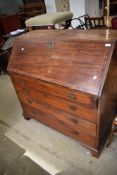 A late Georgian or Victorian mahogany bureau having satinwood line inlay