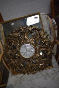 A vintage gilt frame wall mirror and similar clock