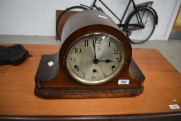 A mid 20th Century oak napoleon mantel clock