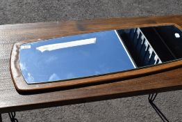 A vintage wood effect wall mirror, width approx. 78cm