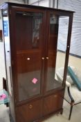 A vintage stag mahogany bookcase/display cabinet