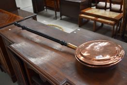 A 19th copper warming pan