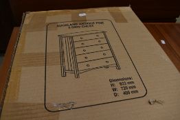 A flatpack pine chest, still boxed