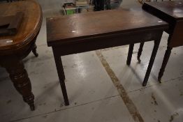 A Victorian oak gate leg table with fold out top