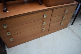 A mid century teak bed side chest of two drawers and a similar mid century teak bedroom chest of