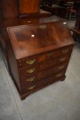 A reproduction mahogany bureau of small proportions, width approx. 74cm
