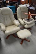 A pair of cream leather easy chairs and footstools (not stressless)