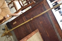 A vintage brass standard lamp
