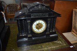A Victorian black marble mantel clock