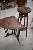 An Arts and Crafts oak jardiniere stand and a corner table