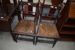 An interesting pair of Victorian bedroom chairs having bobbin frames and ply seats