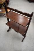 An early 20th Century mahogany folding cake stand