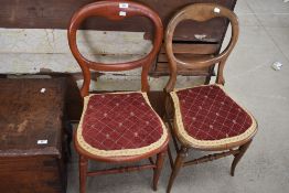 Two Victorian balloon back chairs having beech wood frames with modern upholstery