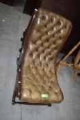 A 19th Century mahogany framed easy chair , having button leather upholstery