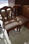 A pair of Victorian balloon back dining chair with mahogany frames