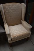 A reproduction easy armchair, nice quality heavy frame and wingbacks