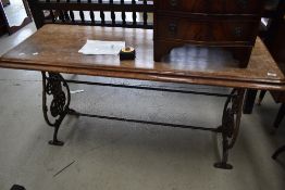 A Victorian mahogany side table having cast iron frame, width approx. 140cm