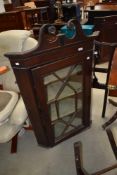 A 19th Century corner unit having astral glazed door and mahogany carcass