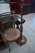 A bentwood chair and a standard lamp