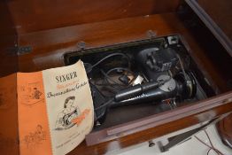 A Singer sewing machine integral table