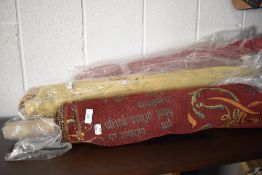 Three rolls of upholstery fabrics.