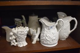 A variety of modern and vintage jugs and vases and a teapot.