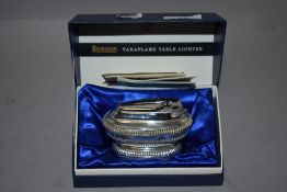 A 1960s boxed Ronson Varaflame table lighter.