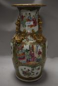 A mid century large West German vase having green ground with unglazed floral pattern, BAY 76-35