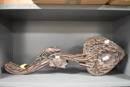 A set of 19th century extensively carved hardwood bellows, having flora and berry design.