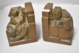 A pair of Art Deco abstract carved oak book ends.
