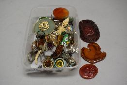 A selection of curios and trinkets including crucifix, rings and pendants etc