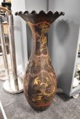 An impressive late 19th/early 20th century black and gilt Japanese vase having decoration of storks,