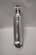 A Mid century fire extinguisherwith wall mount, 'Pyrene trade mark'.