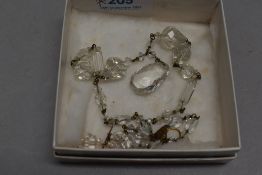 An attractive cut-crystal and gilt metal necklace and earring set, with graduating facet cut links