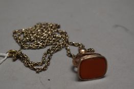 A yellow metal rolled gold fob.