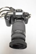 A Canon EOS 1000F camera with Sigme Zoom 75-300mm 1,4-5,6 lens in a soft carry case