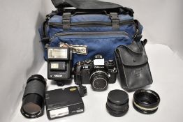 A Nikon F300 camera with Nikkor 50mm 1;1,8 lens No4094950, a Vivitar 70-210mm 1;4,5MC Zoom lens