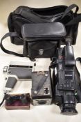 A Samsung video camera in soft bag, a Helina cine camera, a Kodak Six-20 brownie D, and a small pair