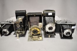 Five folding cameras, a Butcher Cameo, an Adox, a Pocket Ensign, a Kershaw 630 and a Voigtlander