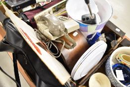 A selection of mixed items including phone leather bag and picnic plates