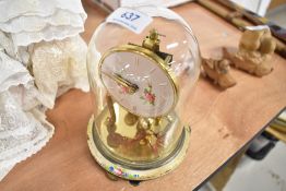 A 20th century brass and glass domed anniversary clock