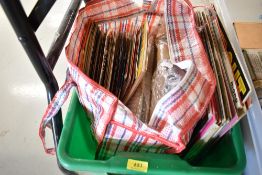 A selection of vinyl records including singles and albums
