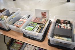 Four boxes of mixed text and reference books including trains and transport